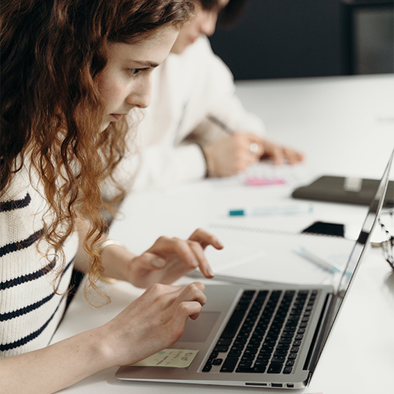 woman types on laptop