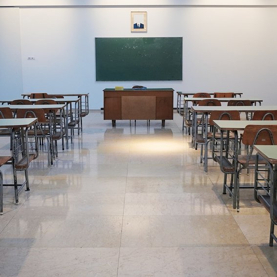 Inside of classroom with chalk board at the front